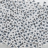 BD00112-02-black-letter-white-opaque-cube-alphabet-beads-single-a-7mm